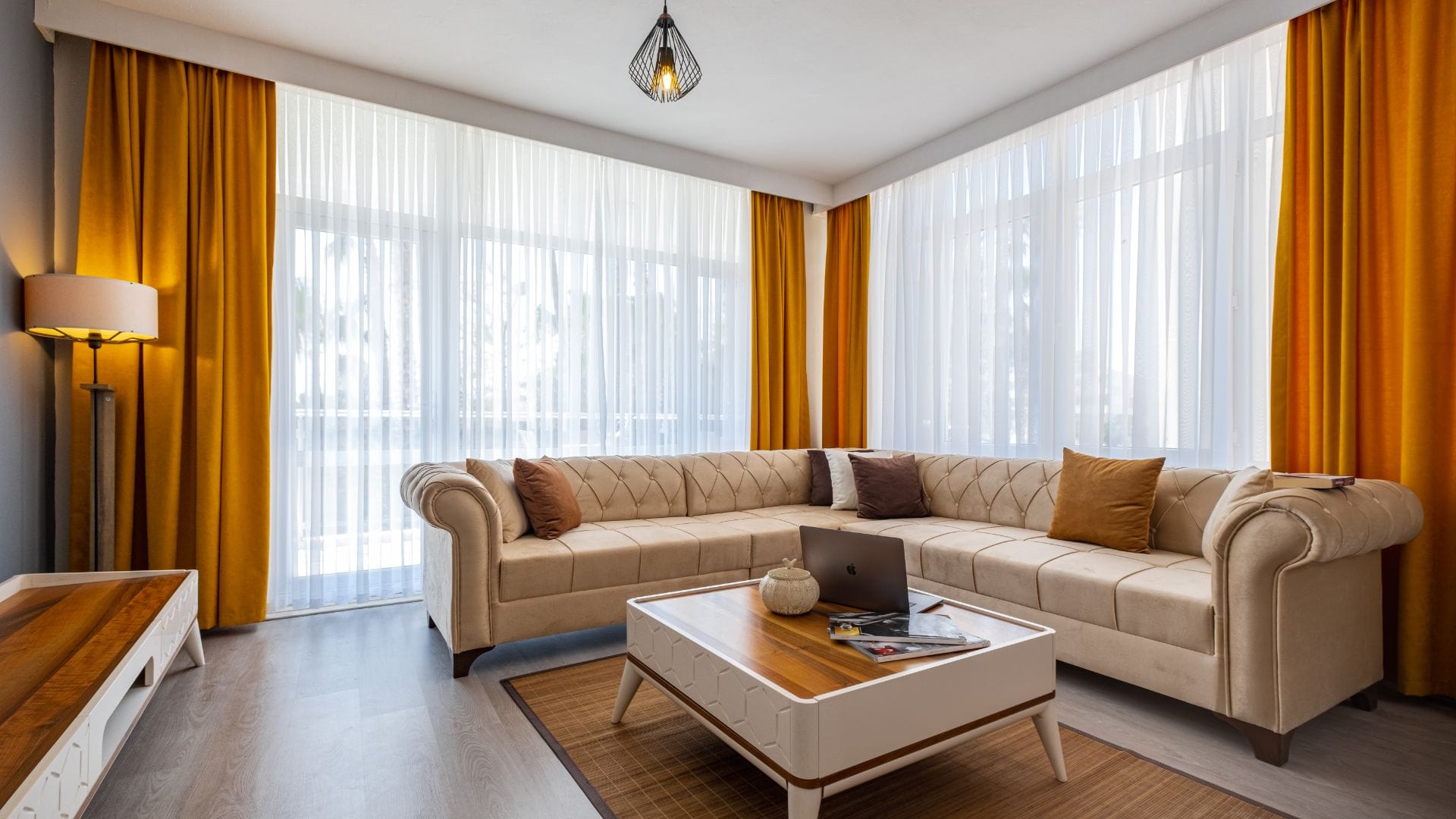 Luxury sheer curtains allowing soft daylight inside the room