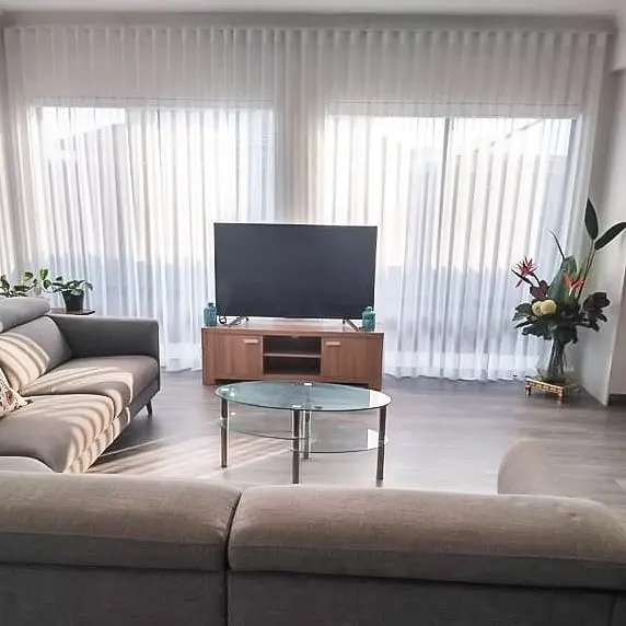 Motorized ceiling-mounted curtains with remote control system