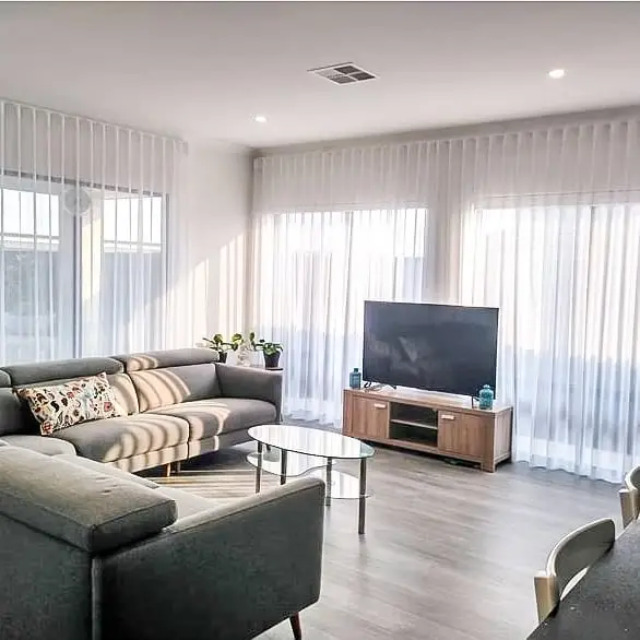 Motorized ceiling-mounted curtains with remote control system